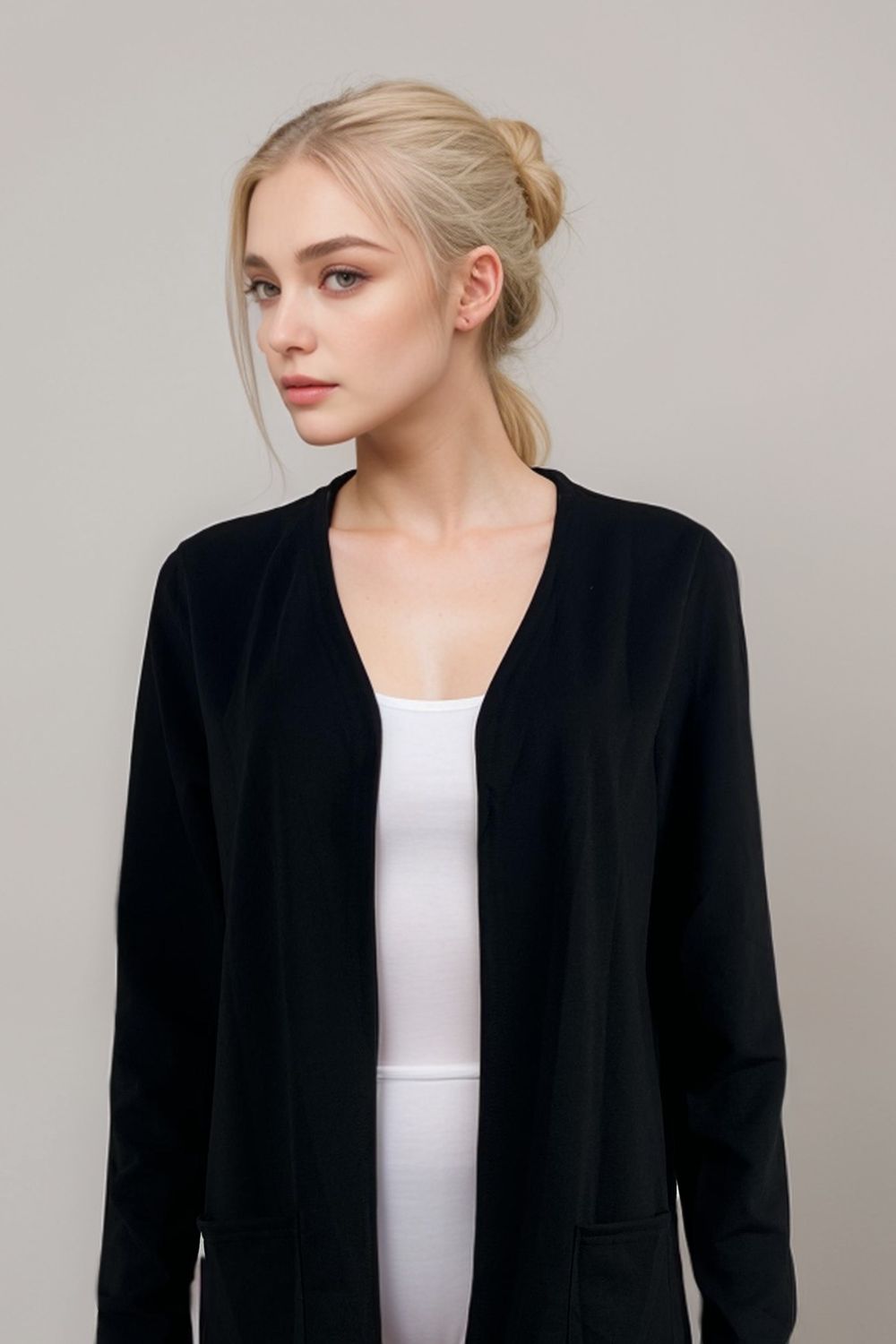 Black long sleeve open front cardigan for women over white tank top