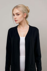 Black long sleeve open front cardigan for women over white tank top