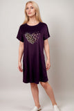 Woman in a purple lounge dress with leopard print heart graphic