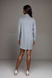 Knitted Sweater Mini DressWoman wearing a grey ribbed knit sweater dress with high neck and boots