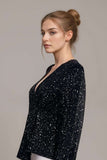 Glitter Long Sleeve TopWoman wearing black glitter bodysuit with long sleeves and plunge neckline
