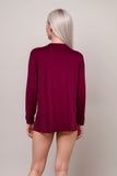 Woman wearing burgundy long sleeve open-front lounge cardigan
