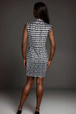 Woman wearing sleeveless black and white houndstooth mini bodycon dress