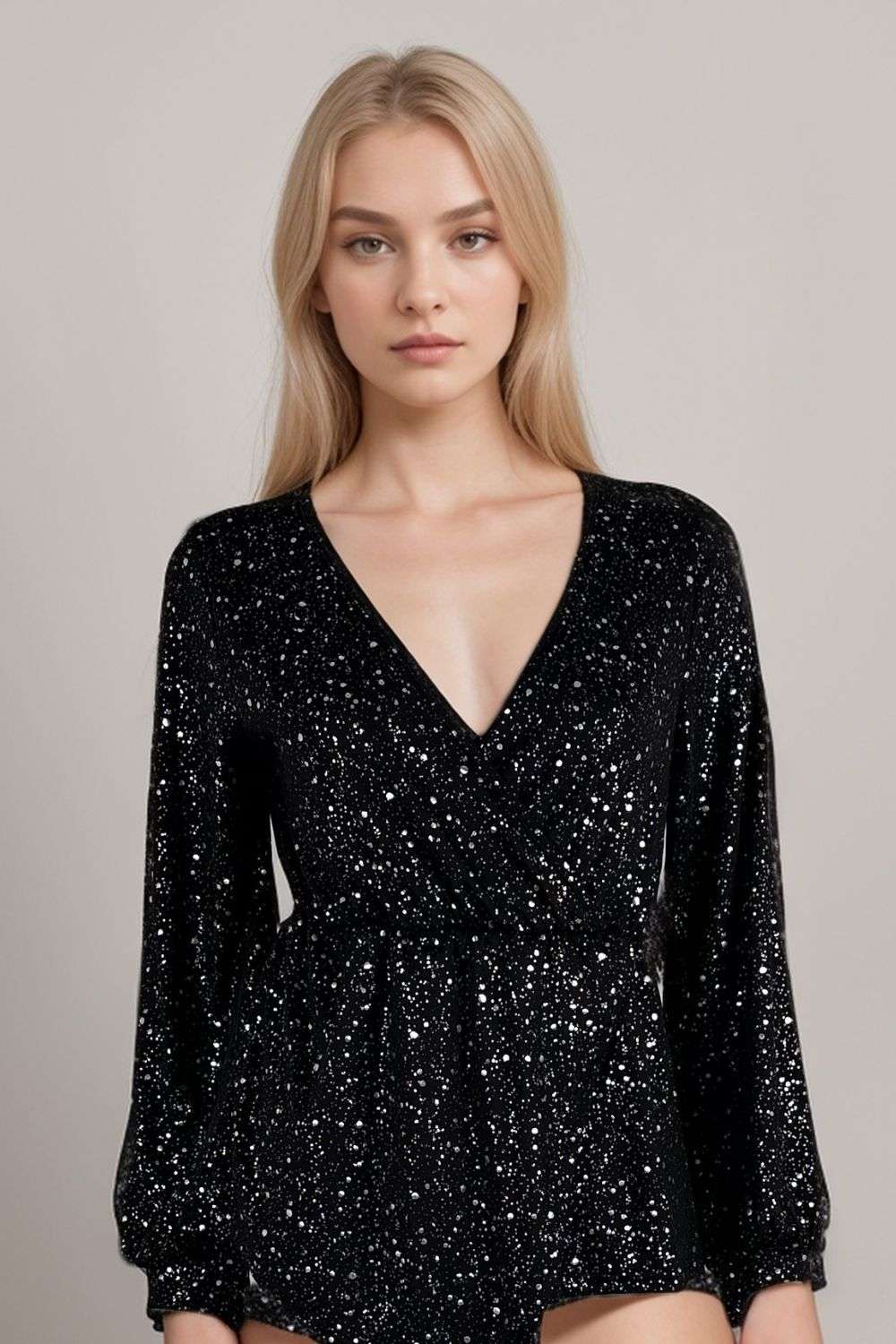 Woman wearing black glitter bodysuit with long sleeves and plunge necklineGlitter Long Sleeve Top