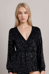 Woman wearing black glitter bodysuit with long sleeves and plunge necklineGlitter Long Sleeve Top