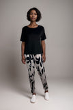 Women’s black pyjama set short sleeve top with abstract print trousers