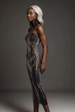 Model showcasing a black and gold striped bodycon midi dress with a sleek fit and strapless design.