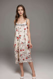 Cream floral print satin slip midi dress with black trim and spaghetti straps