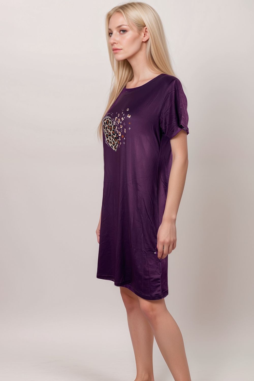 Woman in a purple lounge dress with leopard print heart graphic