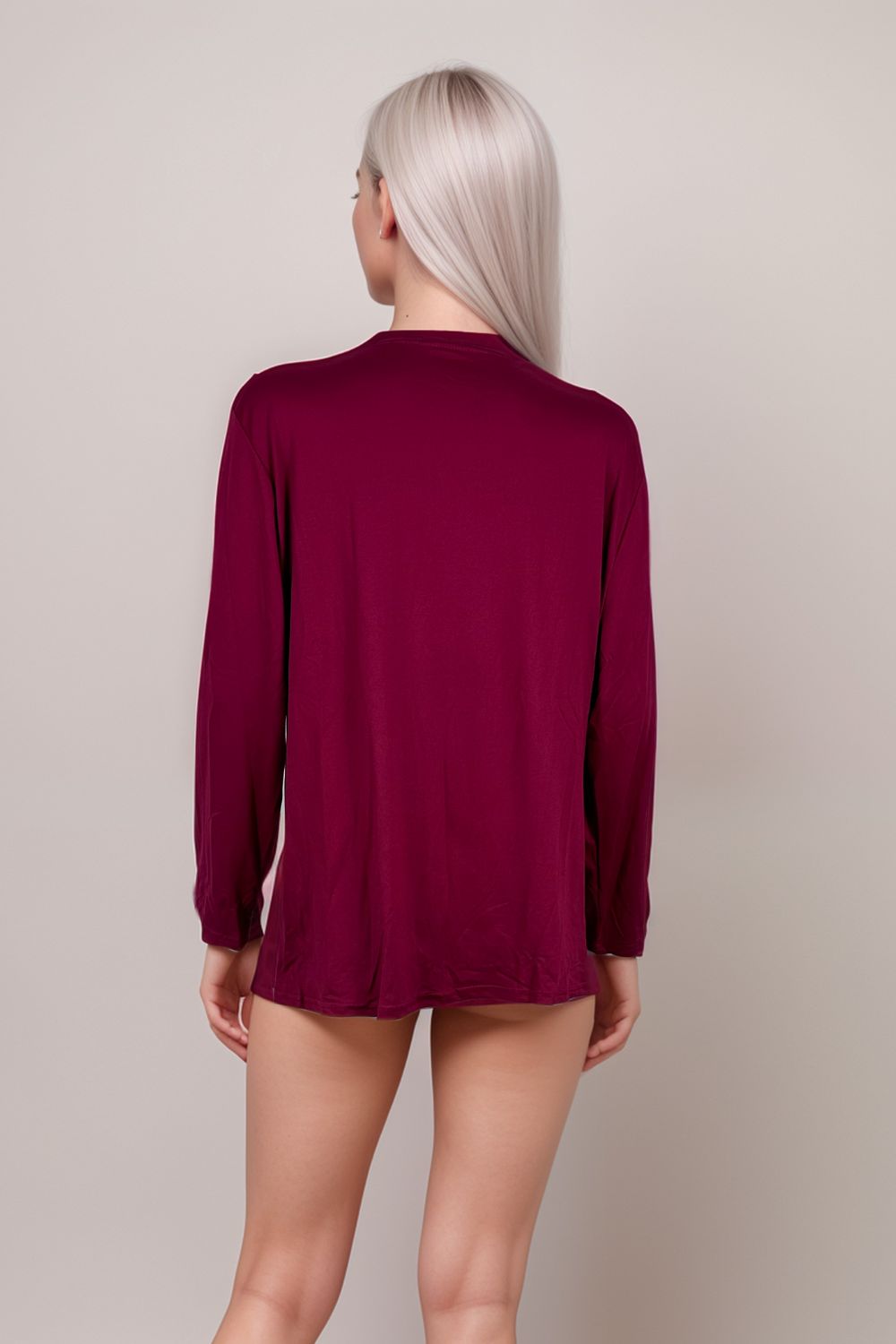 Woman wearing burgundy long sleeve open-front lounge cardigan
