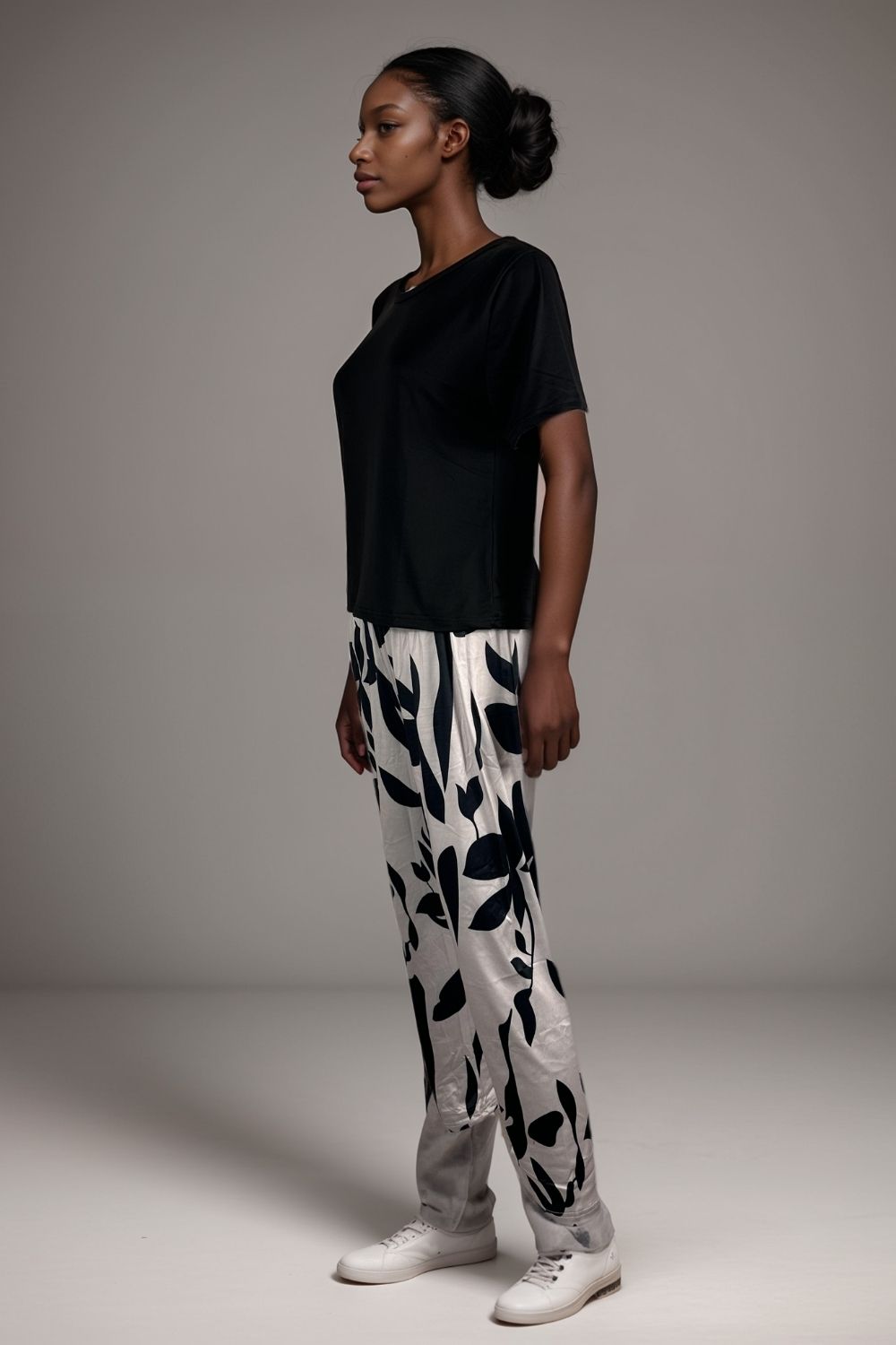 Women’s black pyjama set short sleeve top with abstract print trousers