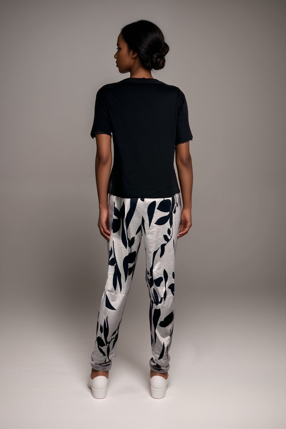Women’s black pyjama set short sleeve top with abstract print trousers